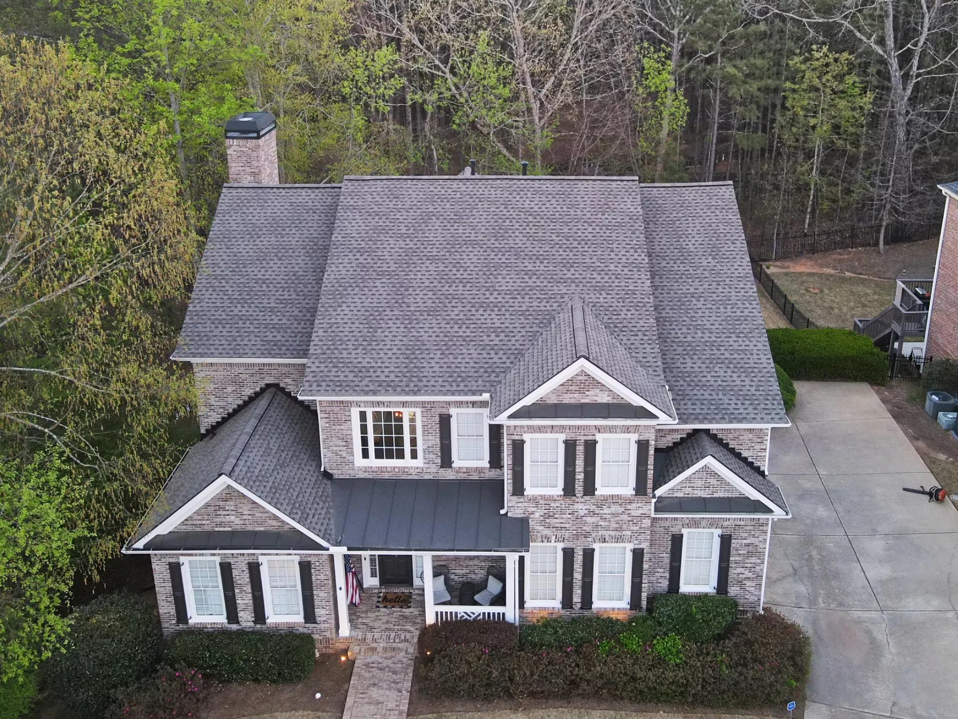 Aerial view of a home with a finished shingle roof